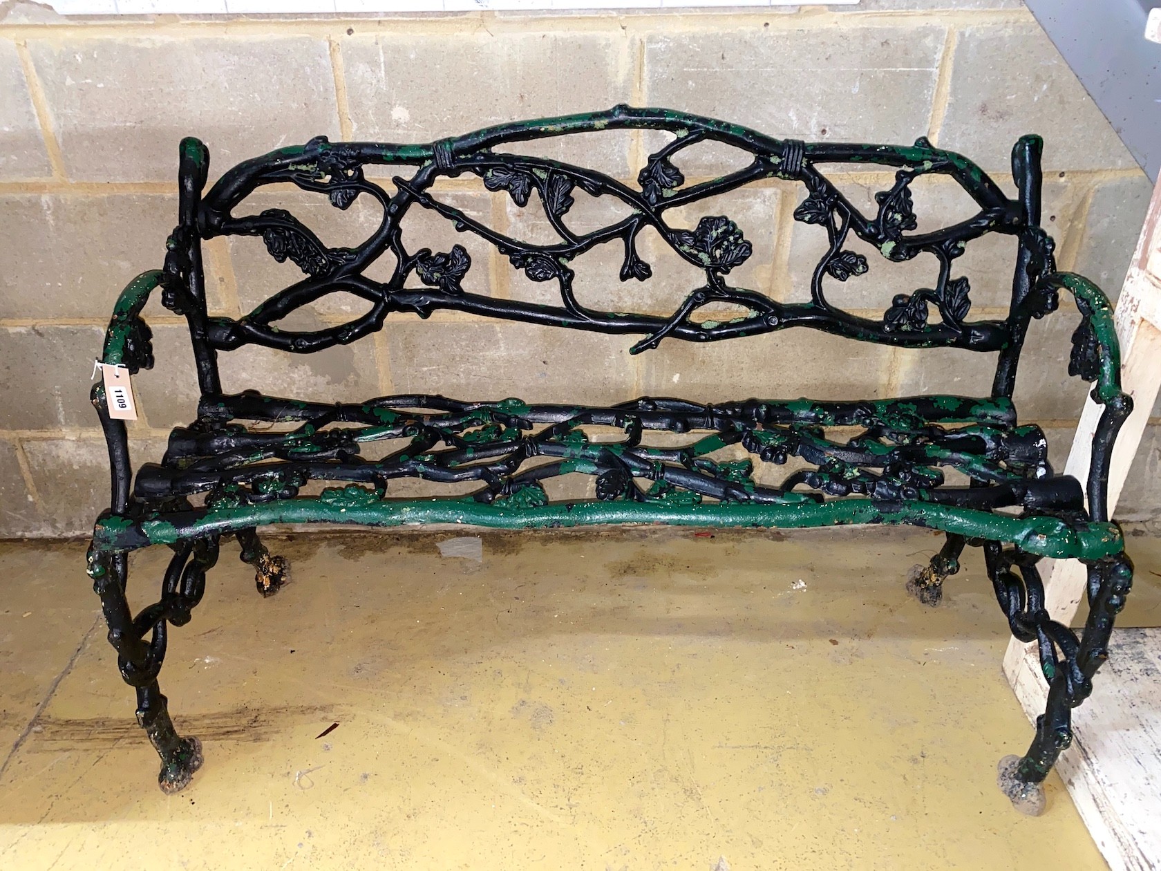 A Victorian Coalbrookdale style cast iron garden bench, length 124cm, depth 57cm, height 77cm